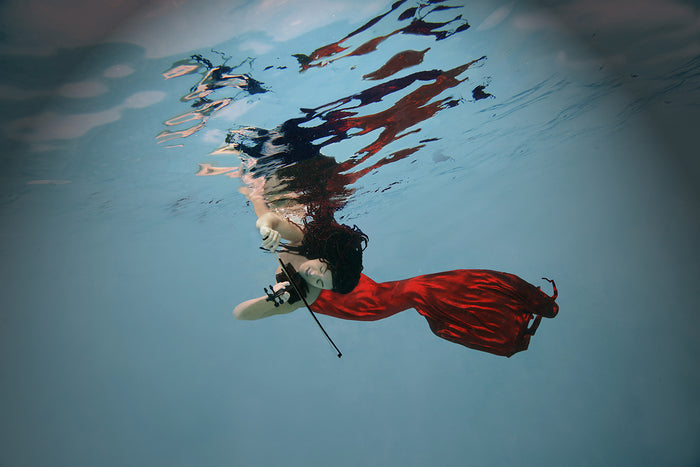 Musical Merman, 2023, underwater fine art photography on canvas, 24 x 36 in. / 60.96 x 91.44 cm.